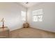 Well-lit bedroom featuring carpet flooring and a nightstand at 3951 W Talc Dr, San Tan Valley, AZ 85144