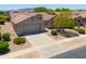 Aerial view of a single-story house with a two-car garage and desert landscaping at 2673 E Santa Maria Dr, Casa Grande, AZ 85194