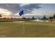 Golf course green with flag and pond featuring a fountain in the background at 2673 E Santa Maria Dr, Casa Grande, AZ 85194