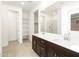 Elegant bathroom featuring double sinks, a large mirror, and ample storage at 3530 E Alexander Dr, San Tan Valley, AZ 85143