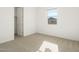 Bright bedroom with neutral carpeting and large closet at 3530 E Alexander Dr, San Tan Valley, AZ 85143