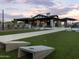 Community lawn with cornhole and clubhouse in background at 3530 E Alexander Dr, San Tan Valley, AZ 85143