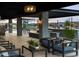 Covered patio with comfortable seating and outdoor kitchen at 3530 E Alexander Dr, San Tan Valley, AZ 85143