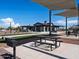 Picnic tables and grills under shade sails in a community area at 3530 E Alexander Dr, San Tan Valley, AZ 85143