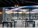 Relaxing community pool with patio tables and umbrellas at 3530 E Alexander Dr, San Tan Valley, AZ 85143