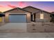 New construction home with gray garage door and stone accents at 3530 E Alexander Dr, San Tan Valley, AZ 85143