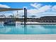 Relaxing pool area with shaded seating and a splash pad at 3530 E Alexander Dr, San Tan Valley, AZ 85143