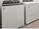 Modern laundry room with Whirlpool washer and dryer at 3530 E Alexander Dr, San Tan Valley, AZ 85143