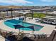 Community pool and surrounding amenities, including a playground at 3530 E Alexander Dr, San Tan Valley, AZ 85143