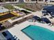Community pool with surrounding lounge chairs and umbrellas at 3530 E Alexander Dr, San Tan Valley, AZ 85143