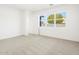 Bright bedroom with neutral carpeting and large window offering natural light at 3530 E Alexander Dr, San Tan Valley, AZ 85143