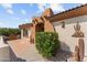 Front entry with tile patio and desert landscaping at 540 Atchison Ln, Wickenburg, AZ 85390