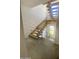 Interior view of a modern staircase with wooden steps and metal railing at 507 E Mountain View Rd, Phoenix, AZ 85020