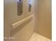 Image of an elevator interior with wooden paneling and control panel at 507 E Mountain View Rd, Phoenix, AZ 85020