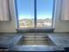 Kitchen sink with dark countertop and mountain views from the window at 507 E Mountain View Rd, Phoenix, AZ 85020