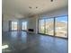 Spacious living room with large windows, tile floors, and a fireplace, offering mountain views at 507 E Mountain View Rd, Phoenix, AZ 85020