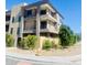 Modern townhome building with balconies, landscaping, and gated entry at 507 E Mountain View Rd, Phoenix, AZ 85020