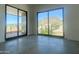 Bright bedroom with sliding glass doors leading to a balcony and mountain views at 507 E Mountain View Rd, Phoenix, AZ 85020
