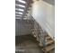 Modern staircase with wood steps and metal railing at 507 E Mountain View Rd, Phoenix, AZ 85020