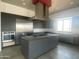 Modern kitchen with stainless steel appliances and a large island at 507 E Mountain View Rd, Phoenix, AZ 85020