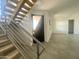 Modern staircase with wood steps and metal railing at 507 E Mountain View Rd, Phoenix, AZ 85020