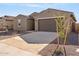 New home's garage and front yard with drought-tolerant landscaping at 3617 E Alexander Dr, San Tan Valley, AZ 85143