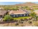 Aerial view showcasing house with backyard and surrounding mountain views at 41253 N Whistling Strait Ct, Anthem, AZ 85086