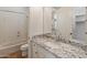 Bathroom with granite countertop and a bathtub at 41253 N Whistling Strait Ct, Anthem, AZ 85086