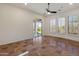 Bright bedroom with tile floors and sliding glass door to patio at 41253 N Whistling Strait Ct, Anthem, AZ 85086