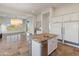 Bright kitchen with large island and white cabinetry at 41253 N Whistling Strait Ct, Anthem, AZ 85086