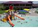 Resort-style pool with water features and a playground at 41253 N Whistling Strait Ct, Anthem, AZ 85086