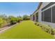 Artificial turf backyard with covered patio at 41253 N Whistling Strait Ct, Anthem, AZ 85086