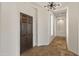 Elegant entryway with dark wood door and tile floors at 41253 N Whistling Strait Ct, Anthem, AZ 85086