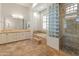 Spacious bathroom with double vanities, a large soaking tub, and a shower at 41253 N Whistling Strait Ct, Anthem, AZ 85086
