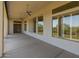 Spacious covered patio with ceiling fans and access to backyard at 41253 N Whistling Strait Ct, Anthem, AZ 85086