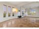 Open living area with a fireplace, large windows, and recessed lighting at 41253 N Whistling Strait Ct, Anthem, AZ 85086