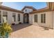 Inviting front courtyard with brick pavers and planters at 41253 N Whistling Strait Ct, Anthem, AZ 85086