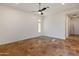 Spacious bedroom with tile flooring and ceiling fan at 41253 N Whistling Strait Ct, Anthem, AZ 85086