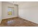Sunlit office space, featuring tile floors and large window at 41253 N Whistling Strait Ct, Anthem, AZ 85086