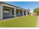 Artificial turf backyard with covered patio at 41253 N Whistling Strait Ct, Anthem, AZ 85086