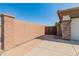 Side yard access with brick walkway and wooden gate at 41253 N Whistling Strait Ct, Anthem, AZ 85086