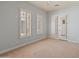Spacious bedroom with outdoor access and neutral tones at 41253 N Whistling Strait Ct, Anthem, AZ 85086