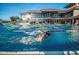 Resort-style pool with multiple lap lanes and clubhouse at 41253 N Whistling Strait Ct, Anthem, AZ 85086