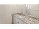 Bathroom with granite countertop and white cabinets at 41253 N Whistling Strait Ct, Anthem, AZ 85086