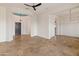 Open living room with tile floors and ceiling fan at 41253 N Whistling Strait Ct, Anthem, AZ 85086