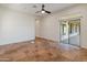 Bedroom with tile floors and sliding glass doors at 41253 N Whistling Strait Ct, Anthem, AZ 85086