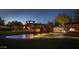 Impressive entrance to Anthem Country Club with fountain and nighttime lighting at 41253 N Whistling Strait Ct, Anthem, AZ 85086