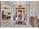 Elegant entryway with high ceilings, a chandelier, and a view of the office at 3220 W Feather Sound Dr, Anthem, AZ 85086
