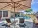 Relaxing pool area with lounge chairs and umbrella at 3220 W Feather Sound Dr, Anthem, AZ 85086