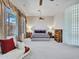 Primary bedroom with glass block wall and fireplace at 3220 W Feather Sound Dr, Anthem, AZ 85086